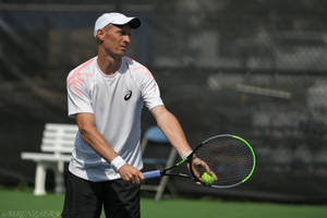 Tennis Champion Nikolay Davydenko Preparing For Serve Wallpaper