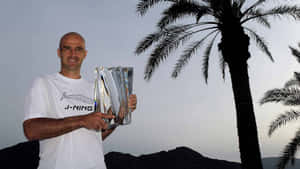 Tennis Champion With Trophy Under Palm Trees Wallpaper