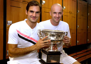 Tennis Championand Coachwith Trophy Wallpaper