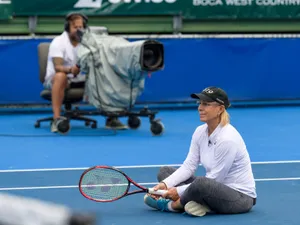 Tennis Icon Martina Navratilova Resting On Court Wallpaper