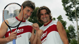 Tennis Legends - David Ferrer And Juan Carlos In Action Wallpaper