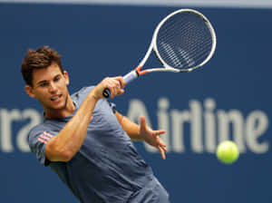 Tennis Player Backhand Action Shot Wallpaper