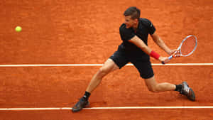 Tennis Player Backhandon Clay Court Wallpaper