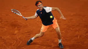 Tennis Player Clay Court Action Wallpaper