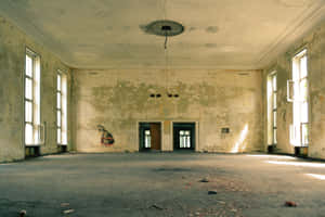 The Aesthetic Of Abandonment: An Empty Room With A Torn Chandelier Wallpaper