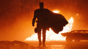 The Batman Walking Away From Flames Wallpaper