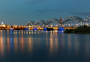 The Beautiful Riga's Railway Bridge At Night Wallpaper