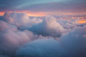 The Beauty Of A Clear Blue Sky And Soft, White, Heavenly Clouds Wallpaper