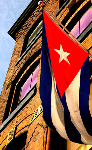 The Cuban Flag Proudly Displayed Outside A Building. Wallpaper