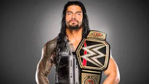 The Electrifying Wwe Logo On A Dynamic Red Background Wallpaper