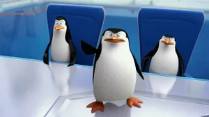 The Elite Squad Of Penguins In Action Wallpaper