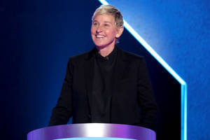 The Ellen Show Host In A Podium Wallpaper