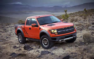 The Ford F - 150 Raptor Is Parked In The Desert Wallpaper