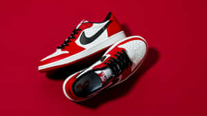 The Iconic Nike Air Jordan 1 Red And White Basketball Sneakers Wallpaper