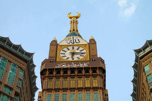 The Intricate Details Of The Clock Tower In Makkah Medina Wallpaper