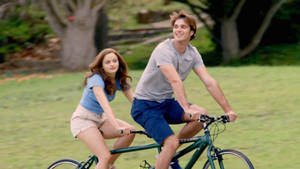 The Kissing Booth Tandem Bicycle Scene Wallpaper