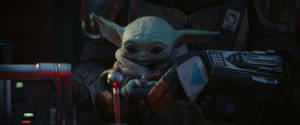 The Mandalorian's Unbreakable Bond - Baby Yoda And The Mandalorian Wallpaper