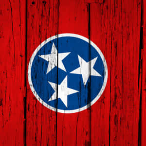 The Official Flag Of Tennessee Is Pictured Against A Blue Background. Wallpaper