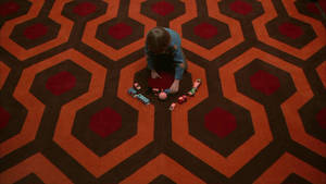The Shining Danny Playing On Carpet Wallpaper