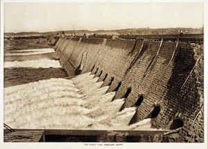 The Spectacular Aswan High Dam In Its Vintage Glory Wallpaper