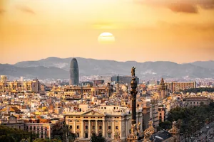 The Sun Is Setting Over The City Wallpaper