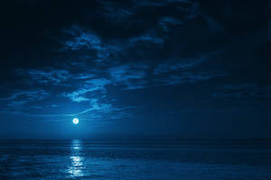 The Vivid Enchantment Of A Full Moon Night Wallpaper