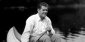 The Young Gene Tunney Sailing A Boat Wallpaper