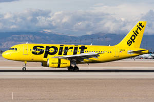 Thick Clouds Spirit Airlines Plane Wallpaper