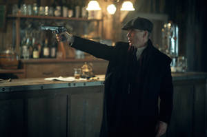 Thomas Shelby Holding A Gun Wallpaper