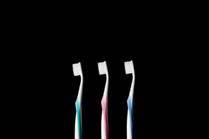 Three Toothbrushes Dentistry Wallpaper