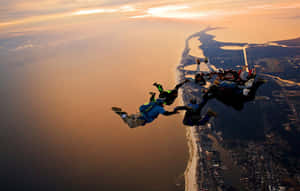 Thrilling Adventure In The Sky - Skydiving Formation Wallpaper