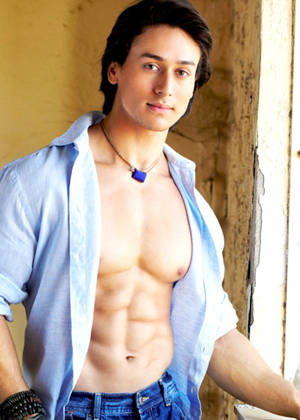 Tiger Shroff Body With Blue Dress Shirt Wallpaper