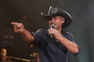 Tim Mcgraw Pointing On Stage Wallpaper