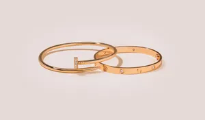 Timeless Luxury With Cartier Gold Nail Bracelet Wallpaper