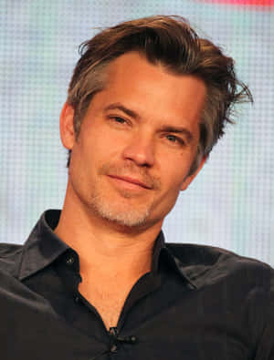 Timothy Olyphant Smiling In A Stylish Attire Wallpaper