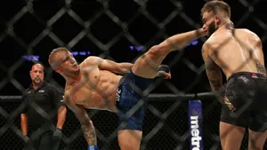 Tj Dillashaw Landing A High Kick Wallpaper