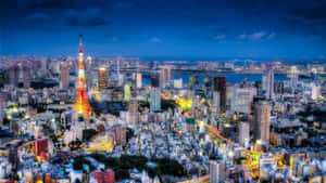 Tokyo City At Night With The Taito Tower Wallpaper