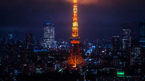 Tokyo Tower Lit Up At Night Wallpaper