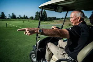 Tom Lehman Driving A Golf Cart Wallpaper