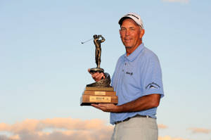 Tom Lehman Holding A Golf Trophy Wallpaper