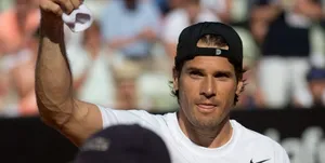 Tommy Haas Holding Up Cloth Wallpaper