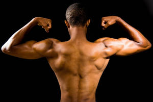 Topless Man Flex Biceps Wallpaper