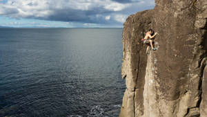 Topless Man Rock Climbing Aerial Photo Wallpaper