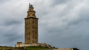 Tower Of Hercules Beneath Cloudy Sky Desktop Wallpaper