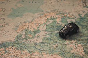 Toy Car With Countries Map Wallpaper