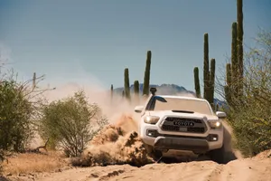 Toyota Trd Driving Through Sand Dunes Wallpaper