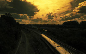 Train In Yellow Sunset Wallpaper