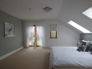 Tranquil Attic Bedroom Oasis Wallpaper