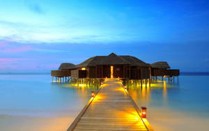 Tranquil Boardwalk On A Scenic Beach Resort Wallpaper