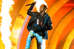 Travis Scott Performing On Stage Wallpaper